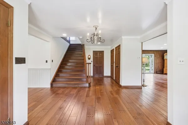 a living room with a fireplace with wooden floor