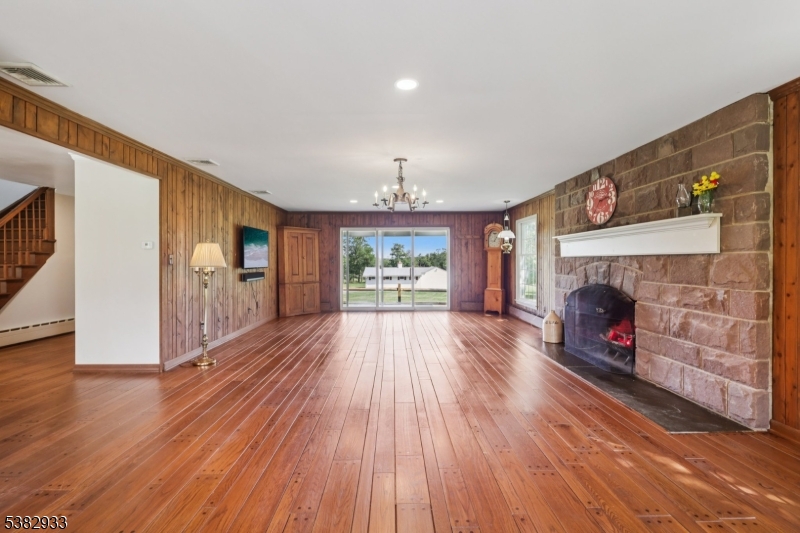 60 Perryville Road Pittstown, NJ 08867 - Photo 15 of 50 a view of a livingroom with wooden floor and a fireplace
