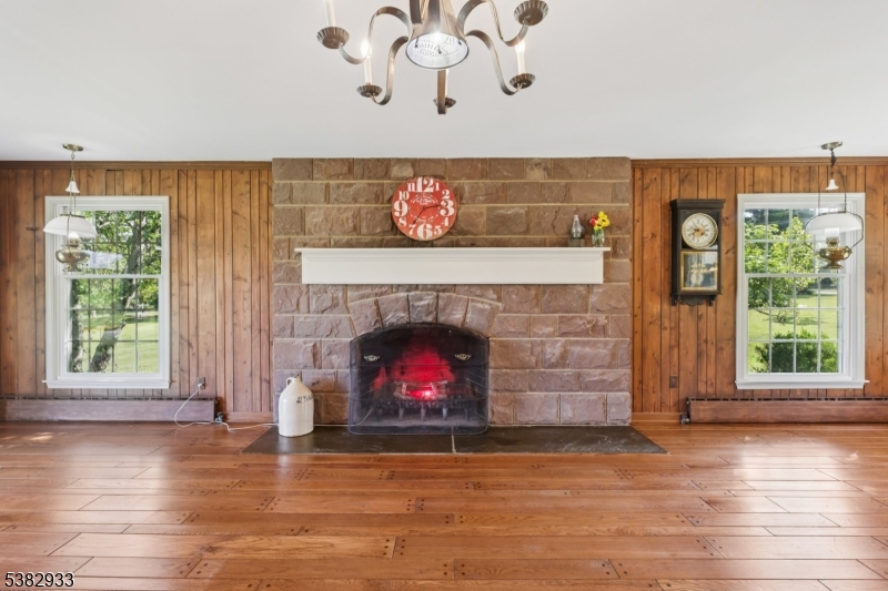 60 Perryville Road Pittstown, NJ 08867 - Photo 16 of 50 a living room with a fireplace with wooden floor