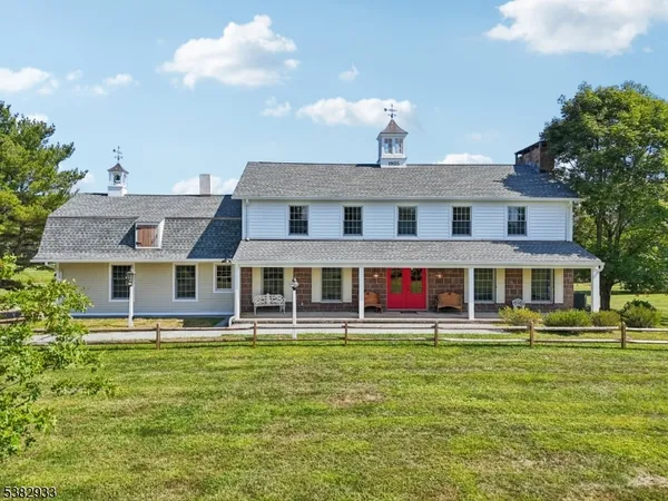 a front view of a building with a yard