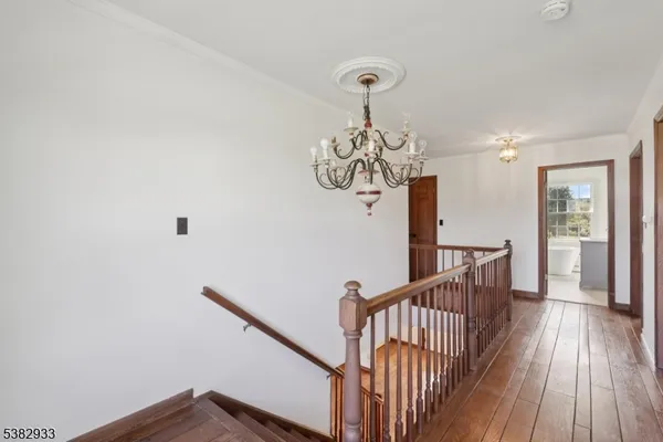 a view of front door with wooden floor
