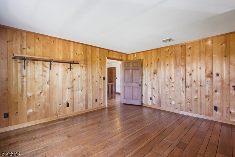 60 Perryville Road Pittstown, NJ 08867 - Photo 23 of 50 a view of an empty room with wooden floor and a window