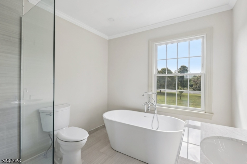 60 Perryville Road Pittstown, NJ 08867 - Photo 26 of 50 a white bath tub sitting next to a toilet