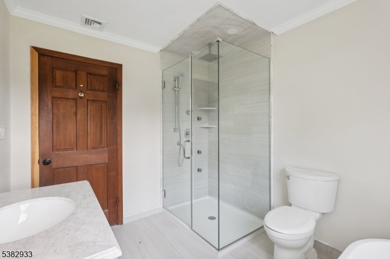 60 Perryville Road Pittstown, NJ 08867 - Photo 27 of 50 a bathroom with a shower and a toilet