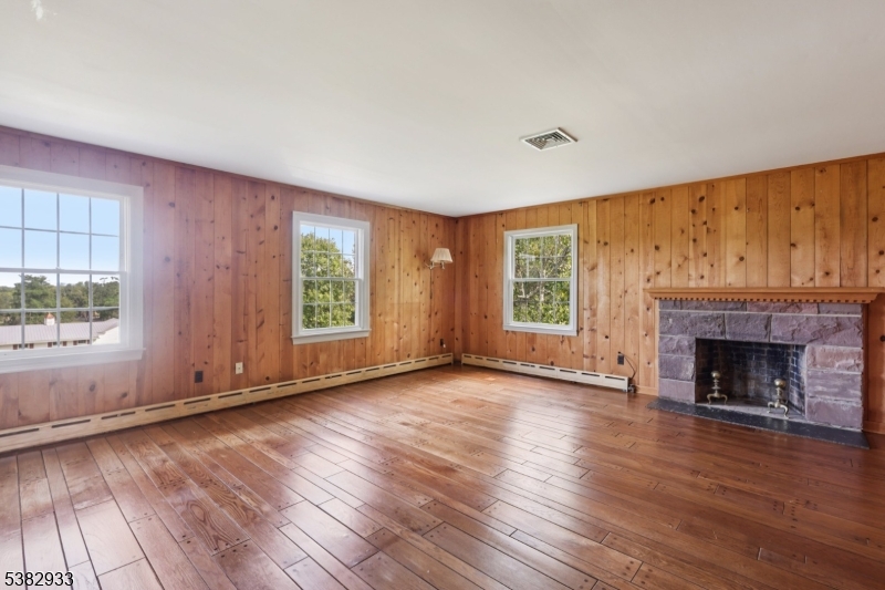 60 Perryville Road Pittstown, NJ 08867 - Photo 29 of 50 an empty room with wooden floor fireplace and windows