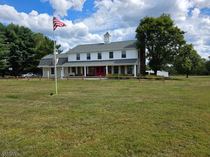 60 Perryville Road Pittstown, NJ 08867 - Photo 3 of 50 a front view of a house with a garden