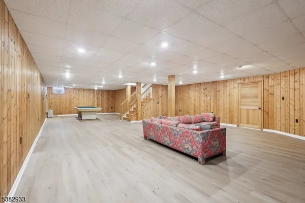 an aerial view of a residential houses with swimming pool and outdoor space