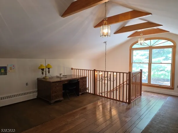 a bathroom with a granite countertop toilet and a shower