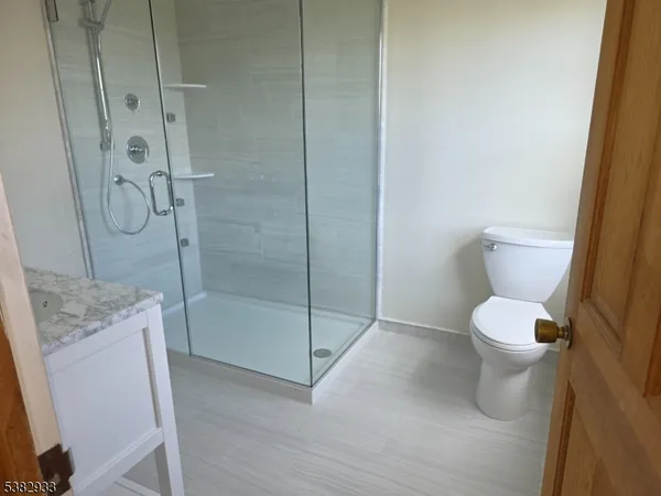 a view of a house with swimming pool and next to a yard