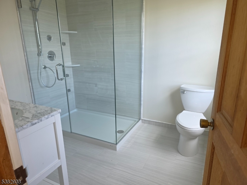 60 Perryville Road Pittstown, NJ 08867 - Photo 8 of 50 a bathroom with a granite countertop toilet and a shower