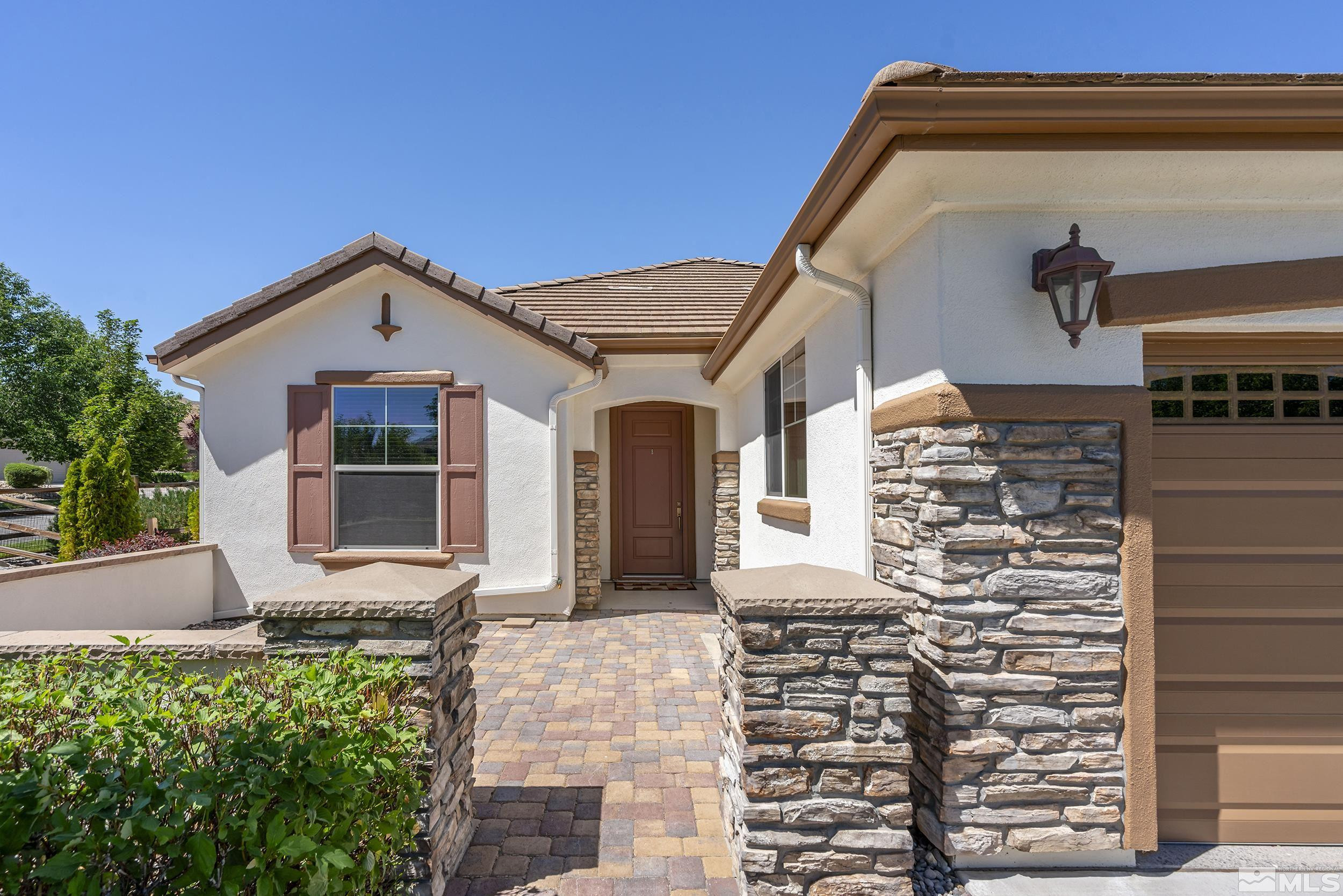 9195 Heritage Ridge Court Reno, NV 89523 - Photo 2 of 30 a front view of a house with windows