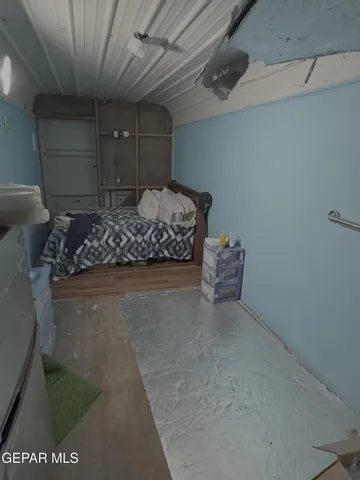 a room with a couch and chairs