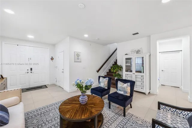 a living room with furniture and a rug