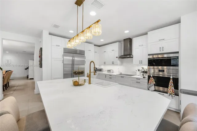 a bathroom with a sink a toilet a shower and a mirror