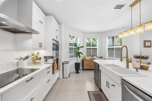a room with a sink and cabinets