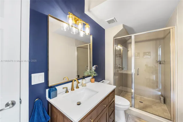 a view of storage and utility room with washer and dryer