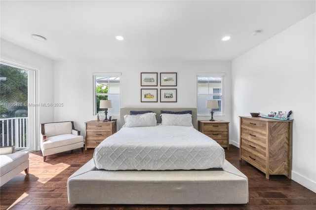 a bathroom with a shower sink and mirror