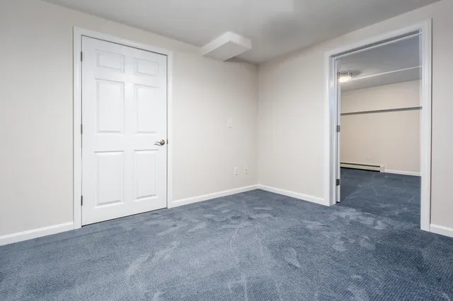 an empty room with closet area