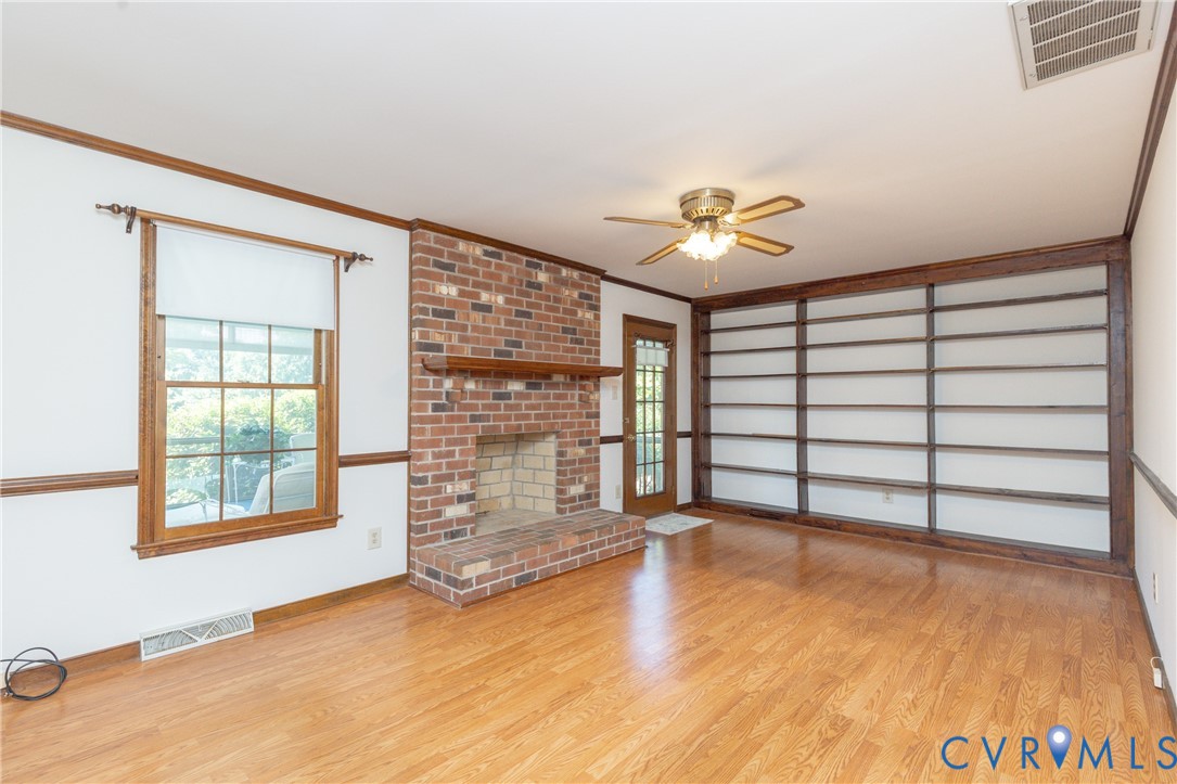 617 Rebel Ridge Road Colonial Heights, VA 23834 - Photo 20 of 49 an empty room with windows and cabinet