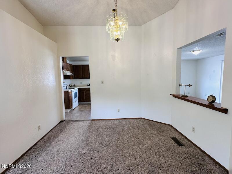 1182 Blue Lakes Road Reno, NV 89523 - Photo 6 of 31 wooden floor in an empty room with a window