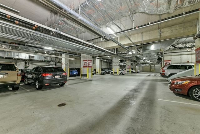 a view of parking garage with cars