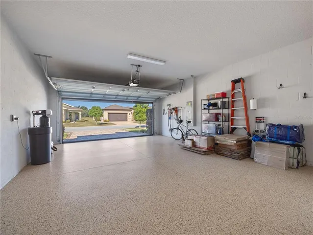 a view of a chairs and table in patio