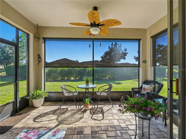 a view of a patio with table and chairs potted plants