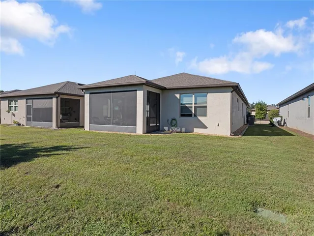 a aerial view of a house with swimming pool