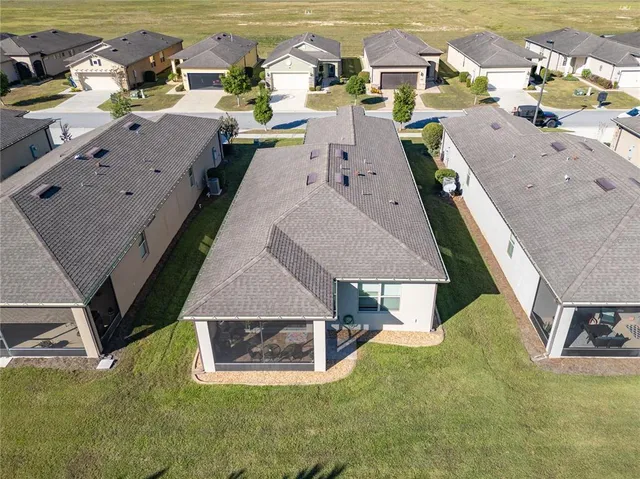 an aerial view of a house with a garden