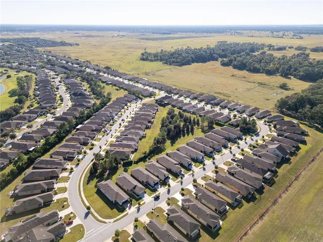 a aerial view of a house with a yard