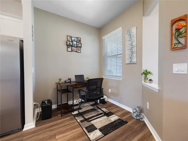a view of workspace with wooden floor outdoor seating and windows