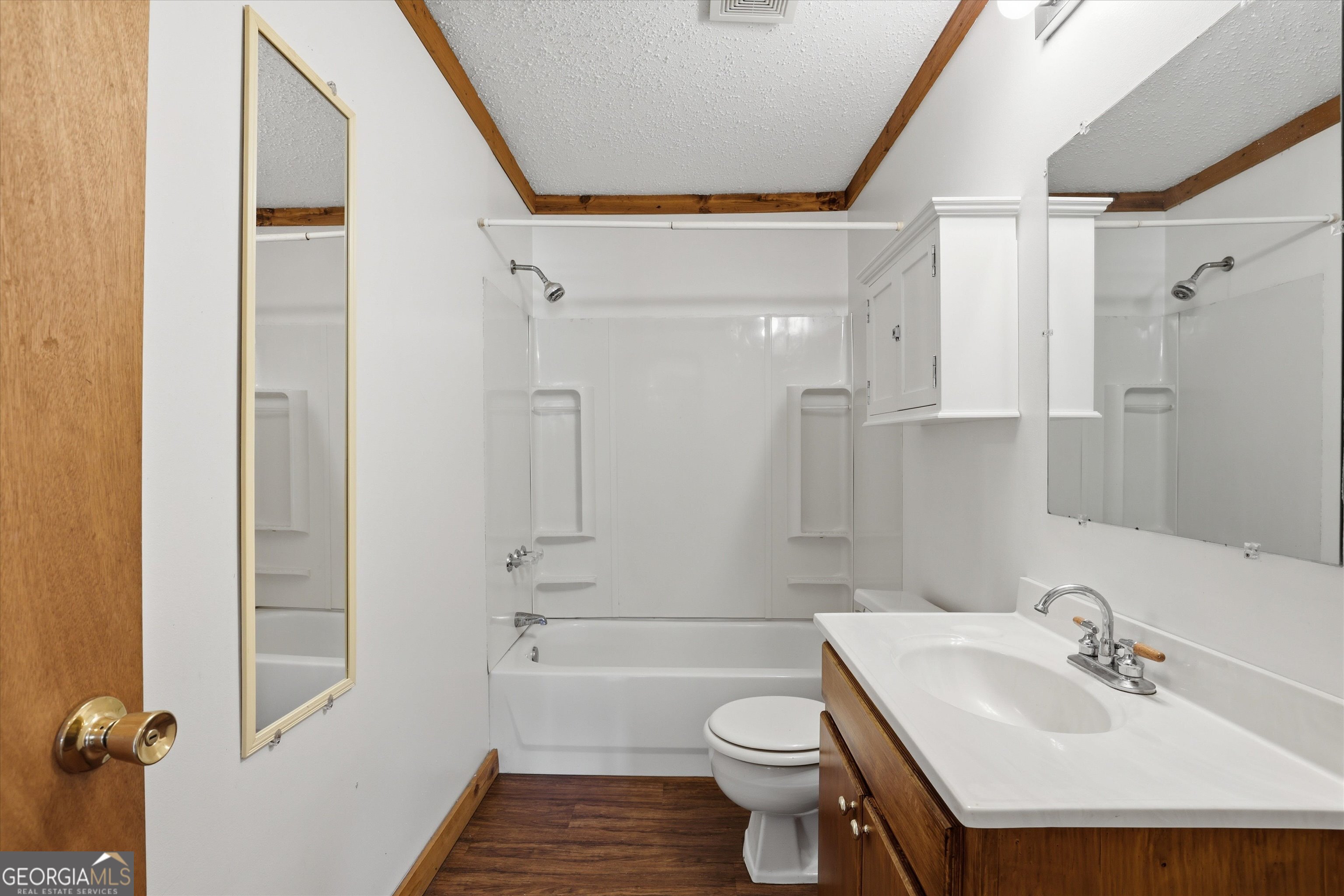 1525 Myron Hart Road Coolidge, GA 31738 - Photo 28 of 58 a bathroom with a sink toilet a shower and a mirror