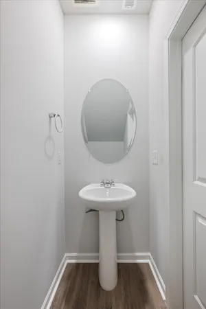 a bathroom with a sink and mirror