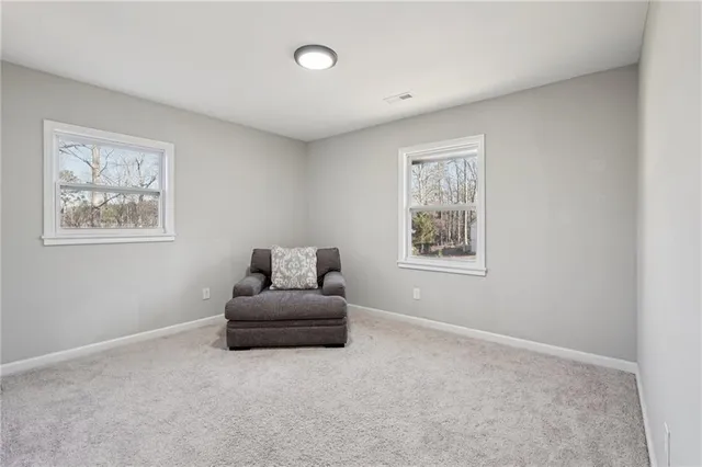 a bedroom with furniture and window