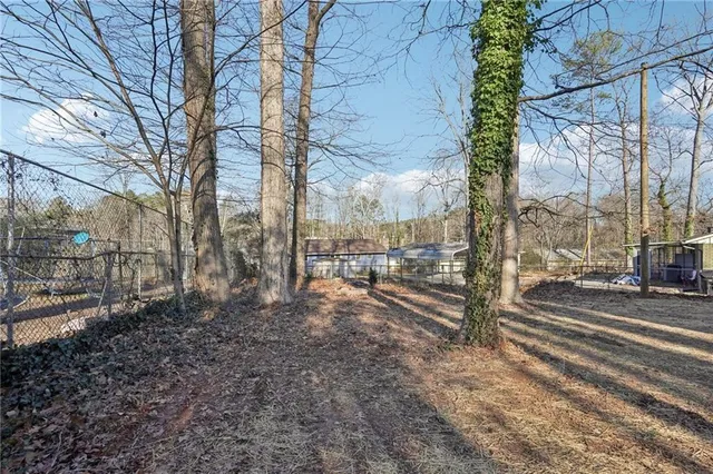 a view of a yard with street view