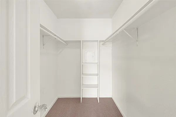 a view of an empty walk in closet