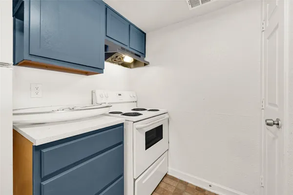 a kitchen with a stove and a microwave