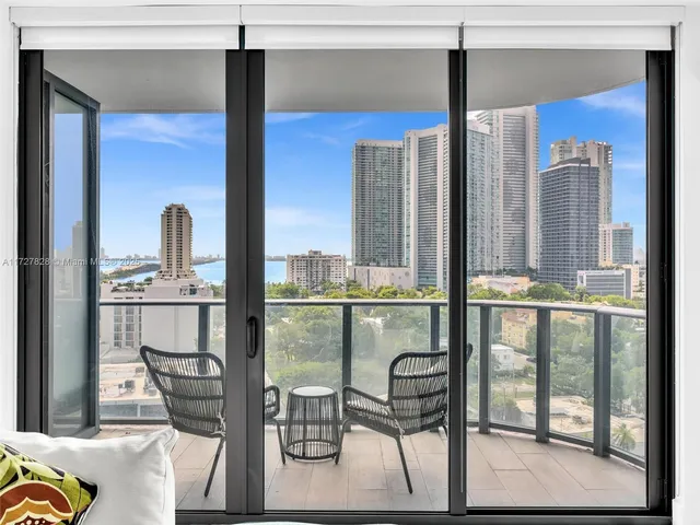 a kitchen with a table chairs and entryway