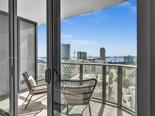 a view of a balcony with furniture