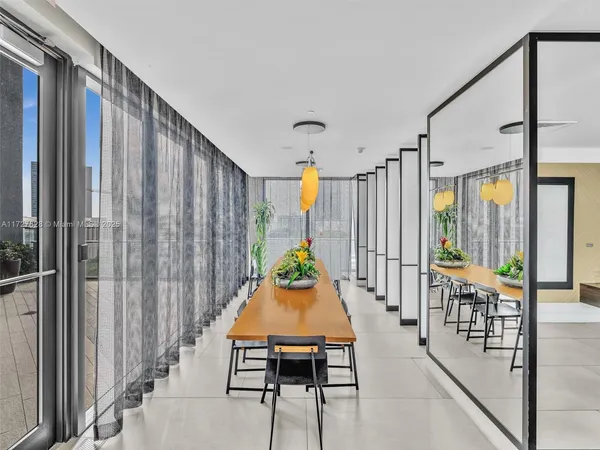a dining room with furniture and window