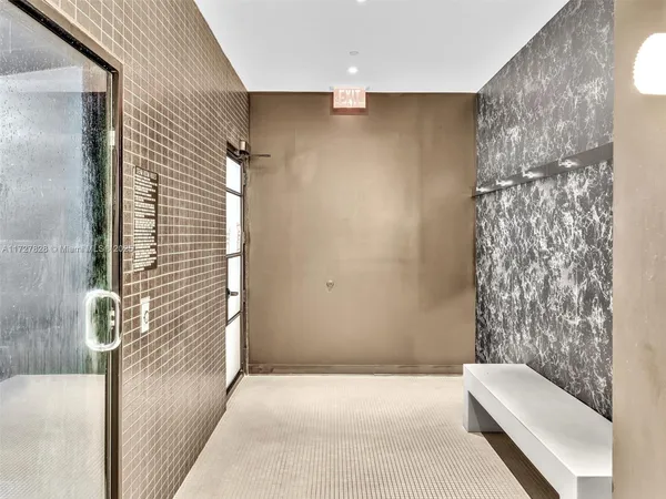 a bathroom with a bathtub and shower