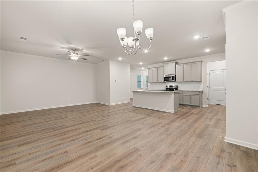4516 Ajo Walk Atlanta, GA 30331 - Photo 11 of 13 a view of a kitchen with cabinets wooden floor and a view of kitchen
