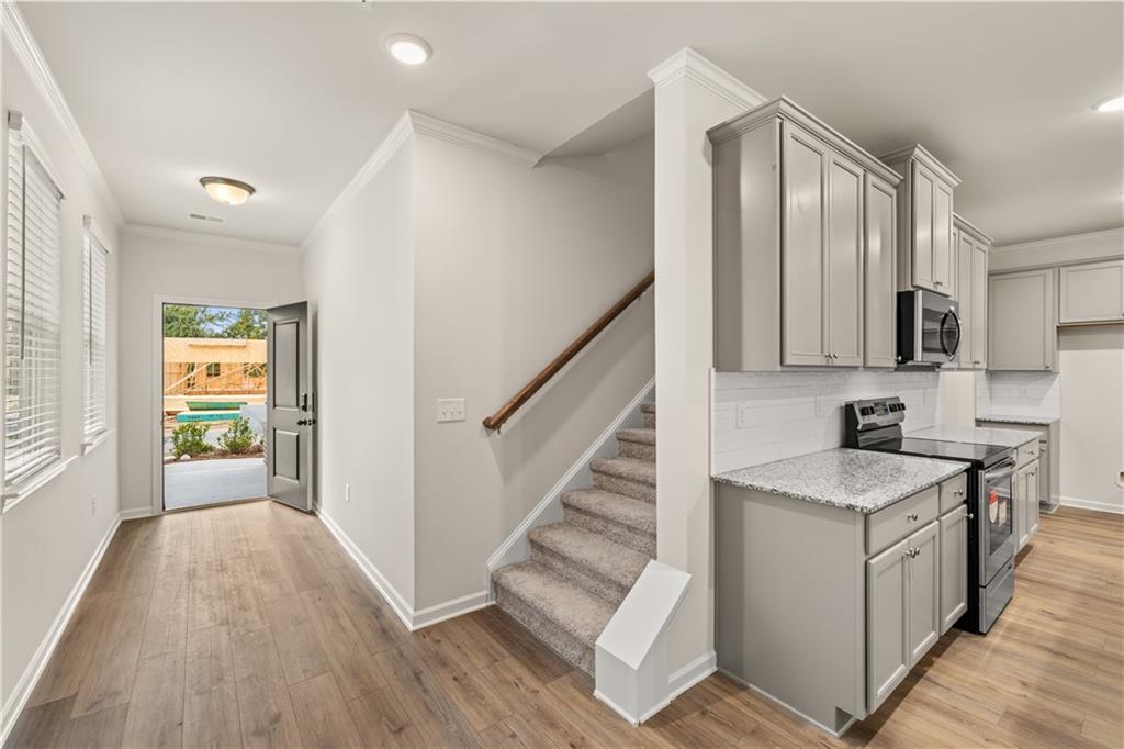 4516 Ajo Walk Atlanta, GA 30331 - Photo 3 of 13 a view of entryway with kitchen and wooden floor
