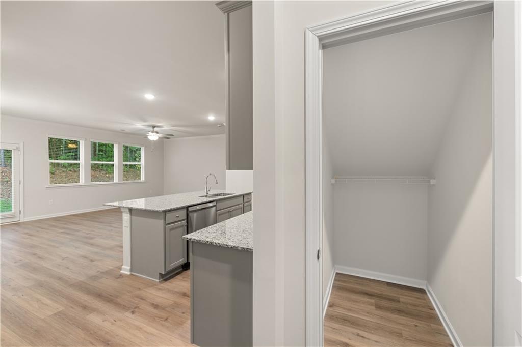 4516 Ajo Walk Atlanta, GA 30331 - Photo 9 of 13 a kitchen with granite countertop a stove and a sink