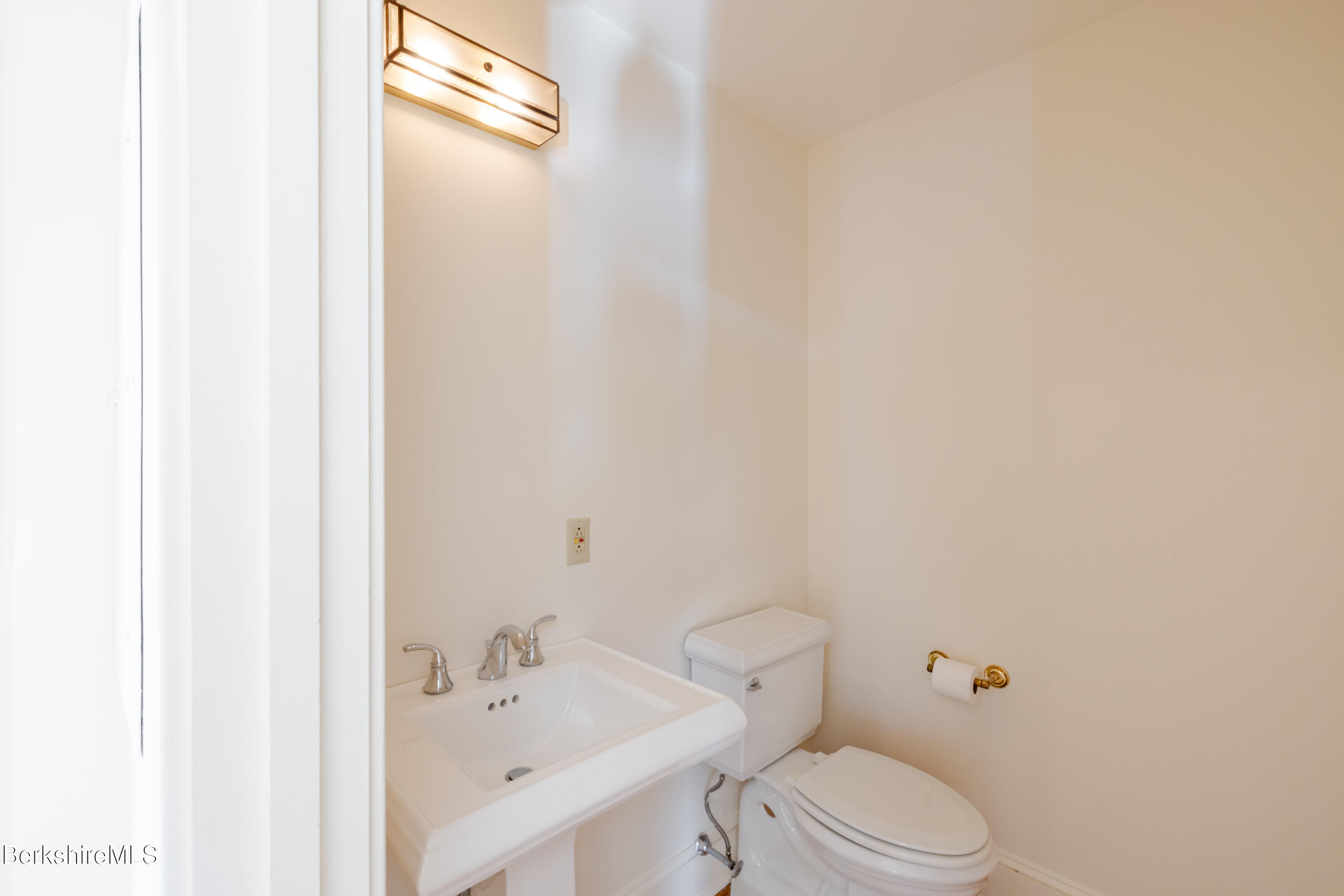 200 Vanna # 3 Old Stockbridge Road Stockbridge, MA 01262 - Photo 14 of 29 a white toilet sitting next to a bathroom sink