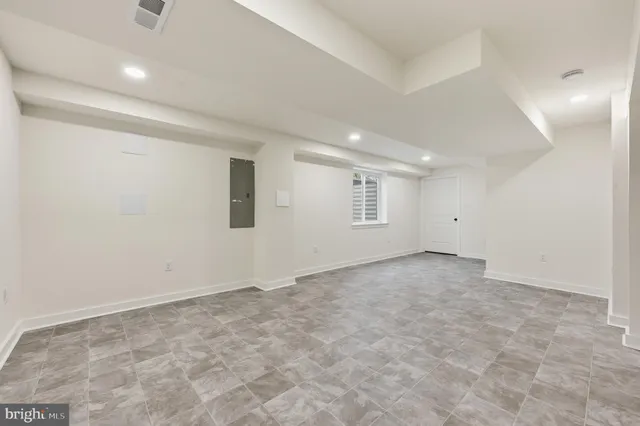 an empty room with a empty space and windows