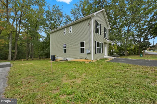 a backyard of a house with lots of green space