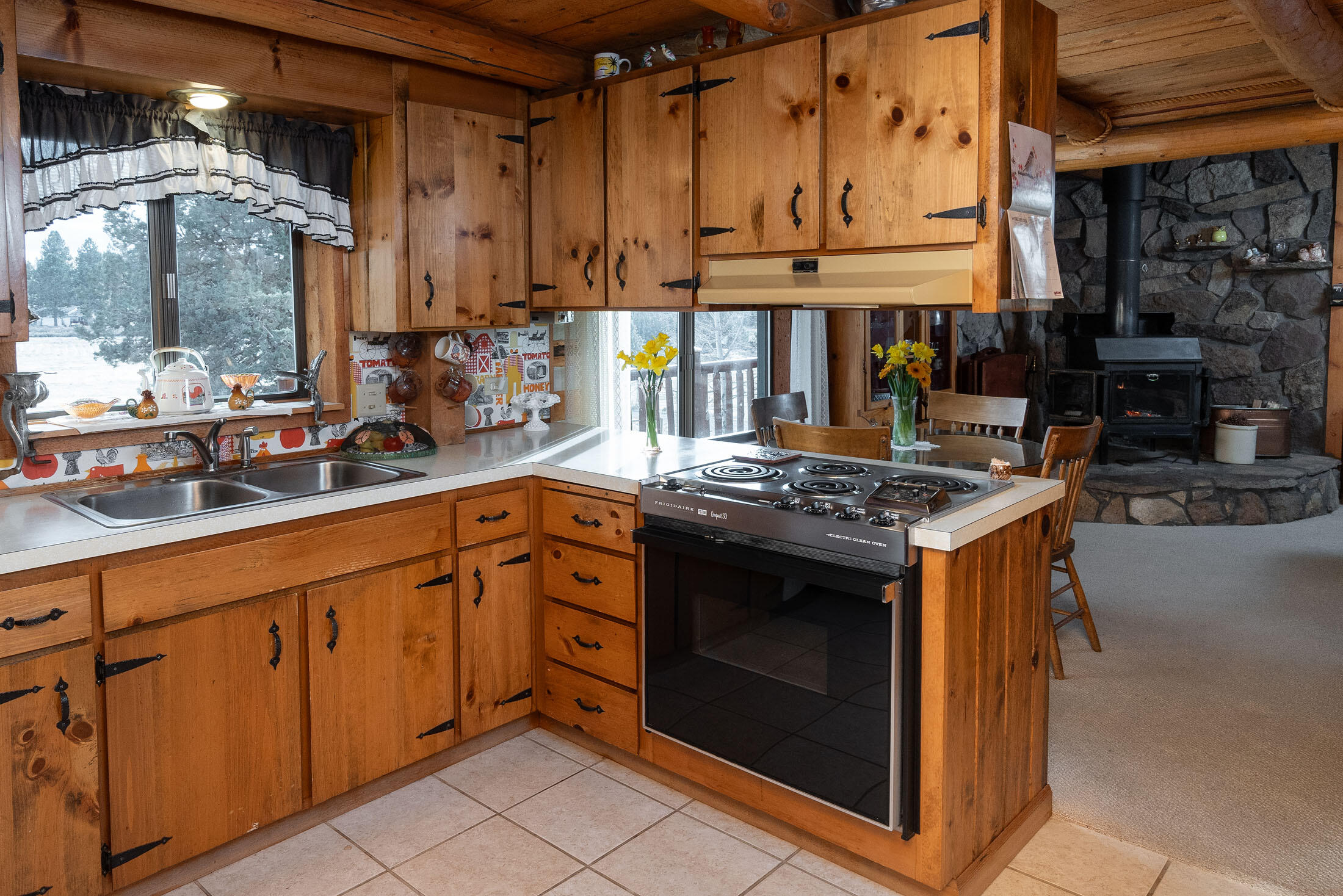 60384 Arnold Market Road Bend, OR 97702 - Photo 20 of 93 a kitchen with stainless steel appliances granite countertop a stove and a sink