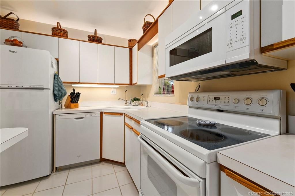 1913 Southwest Palm City Road, Unit 7F Stuart, FL 34994 - Photo 5 of 28 a utility room with dryer and washer