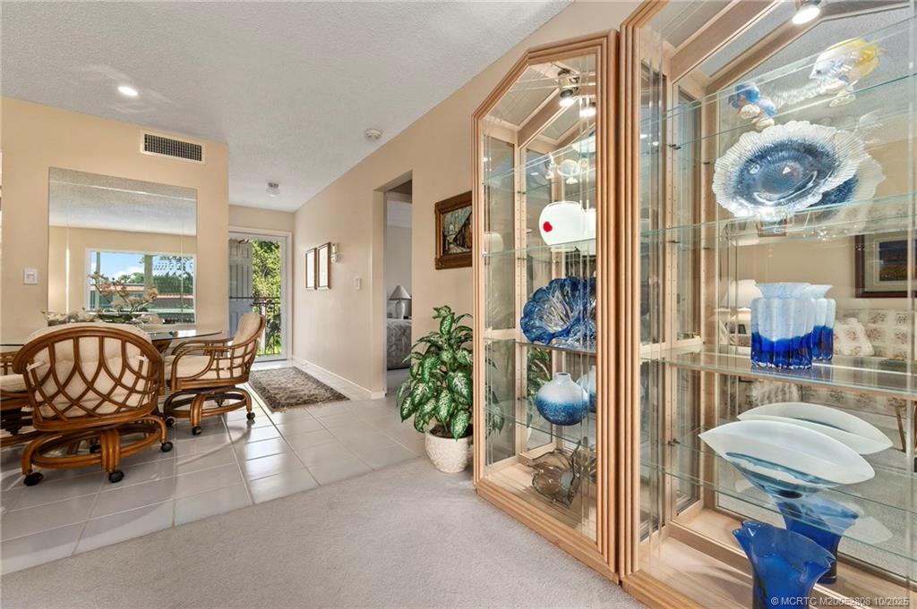 1913 Southwest Palm City Road, Unit 7F Stuart, FL 34994 - Photo 8 of 28 a living room with furniture and a large window